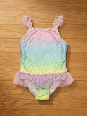 Revolution Swimwear Tag Detail with Pink and Blue Accents